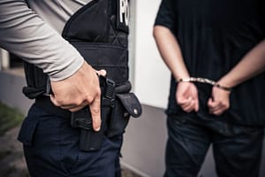 Police arresting a man for facing a first domestic assult charge in toronto